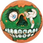Classic green Madball with exposed teeth, eye and worm