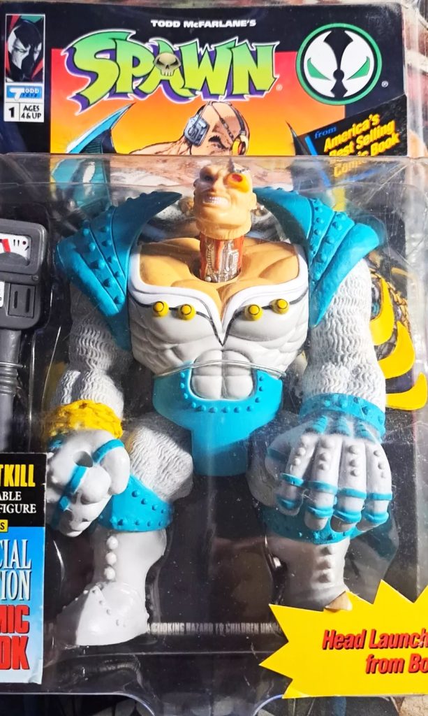 Early McFarlane Toys Spawn figures with flowing cape alongside Violator and Clown