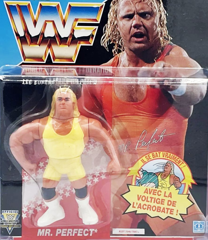 WWE action figures across eras: LJN, Hasbro, Jakks, Mattel Elite posed around a ring
